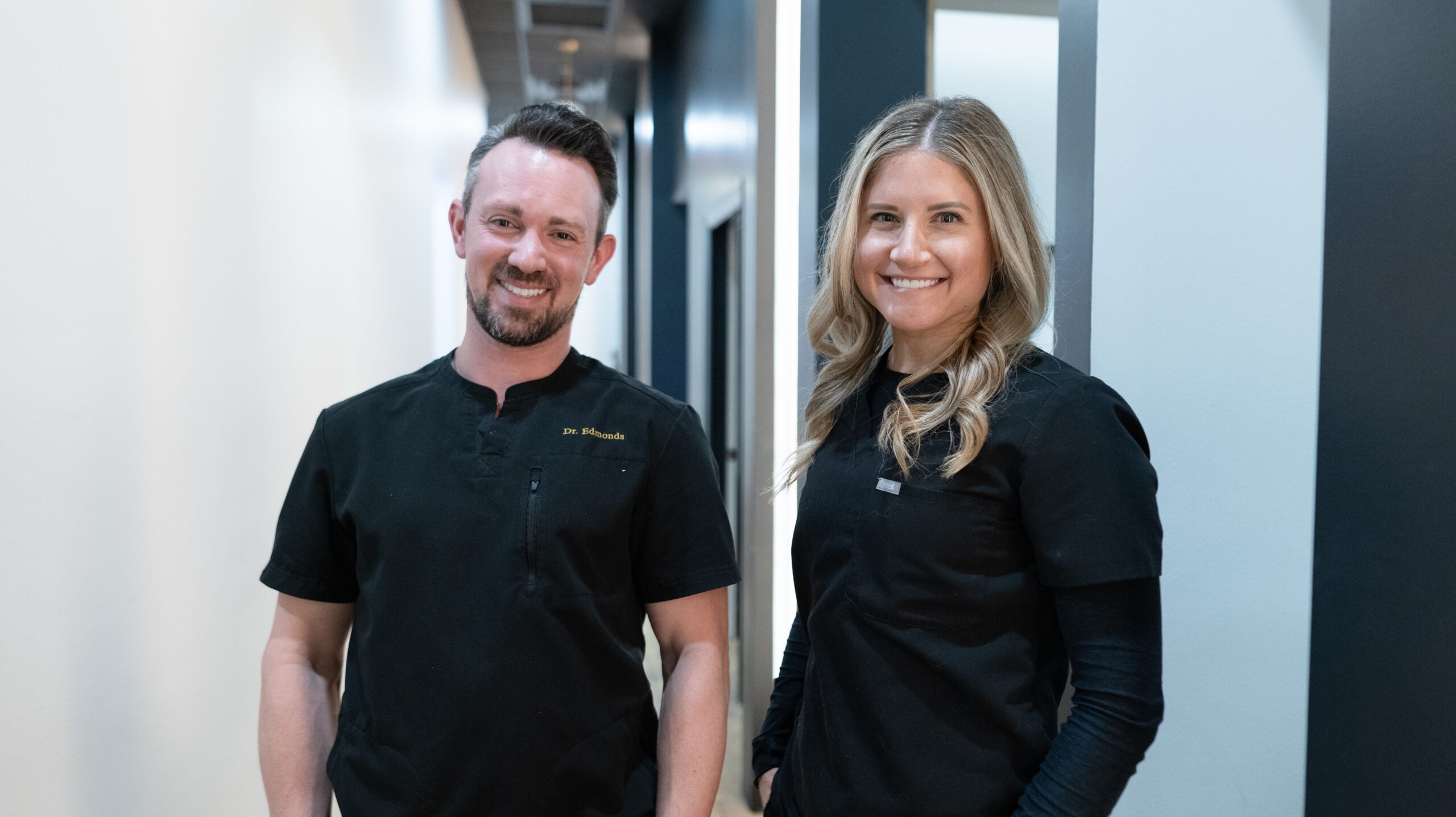 Dr. Andrew Edmonds and Dr. Brenna Sura striking a smile pose - Dentist Georgetown TX Dr. Andrew Edmonds and Dr. Brenna Sura striking a smile pose - Dentist Georgetown TX