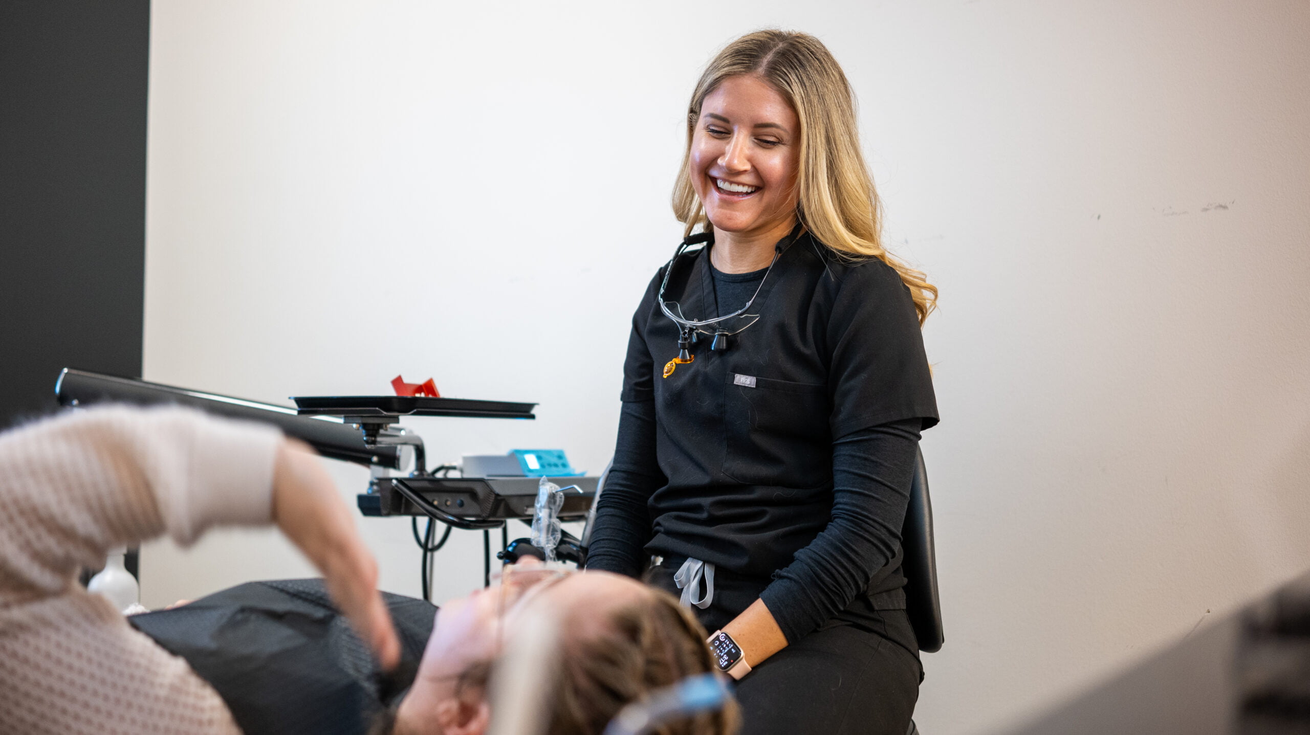 Dr. Brenna Sura smiling gracefully while talking to the patient - Dentist Georgetown TX Dr. Brenna Sura smiling gracefully while talking to the patient - Dentist Georgetown TX