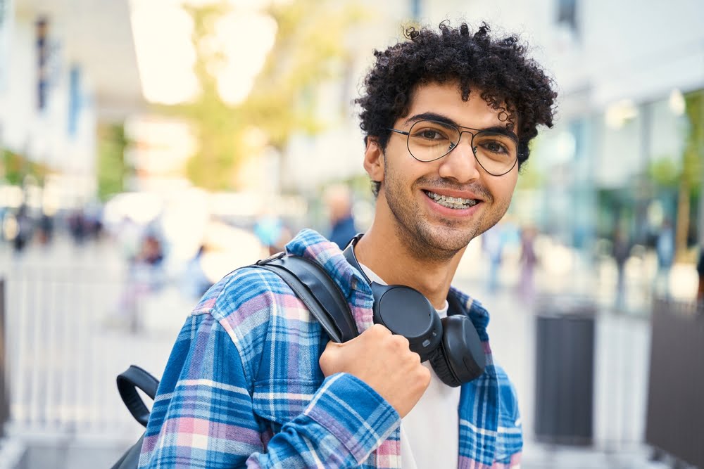 Portrait of handsome man with braces