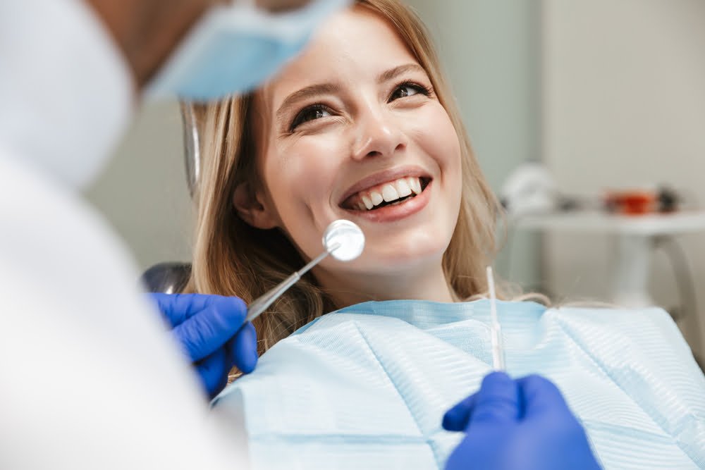 Woman having a dental check up - Dental Sensitivity in Georgetown, TX